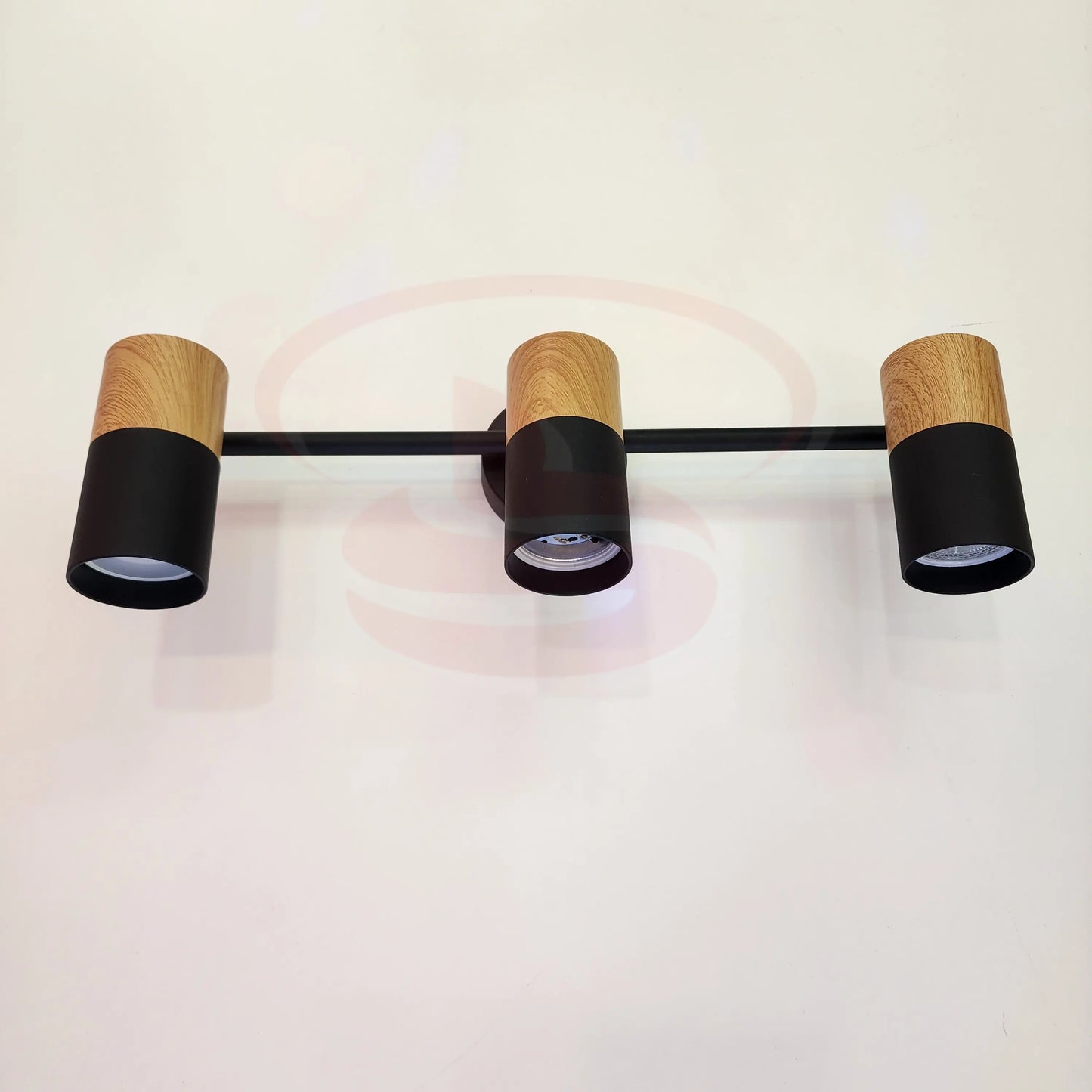A modern indoor wall spotlight featuring a black rod base and wooden cylinder heads, 3 in One GU10 Globe for home and commercial interiors.
Smart Life Lighting & Electrical