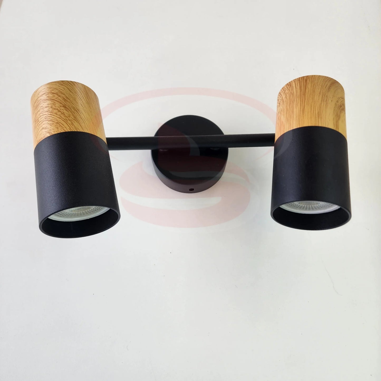 A modern indoor wall spotlight featuring a black rod base and wooden cylinder heads, 2 in One GU10 Globe for home and commercial interiors.
Smart Life Lighting & Electrical