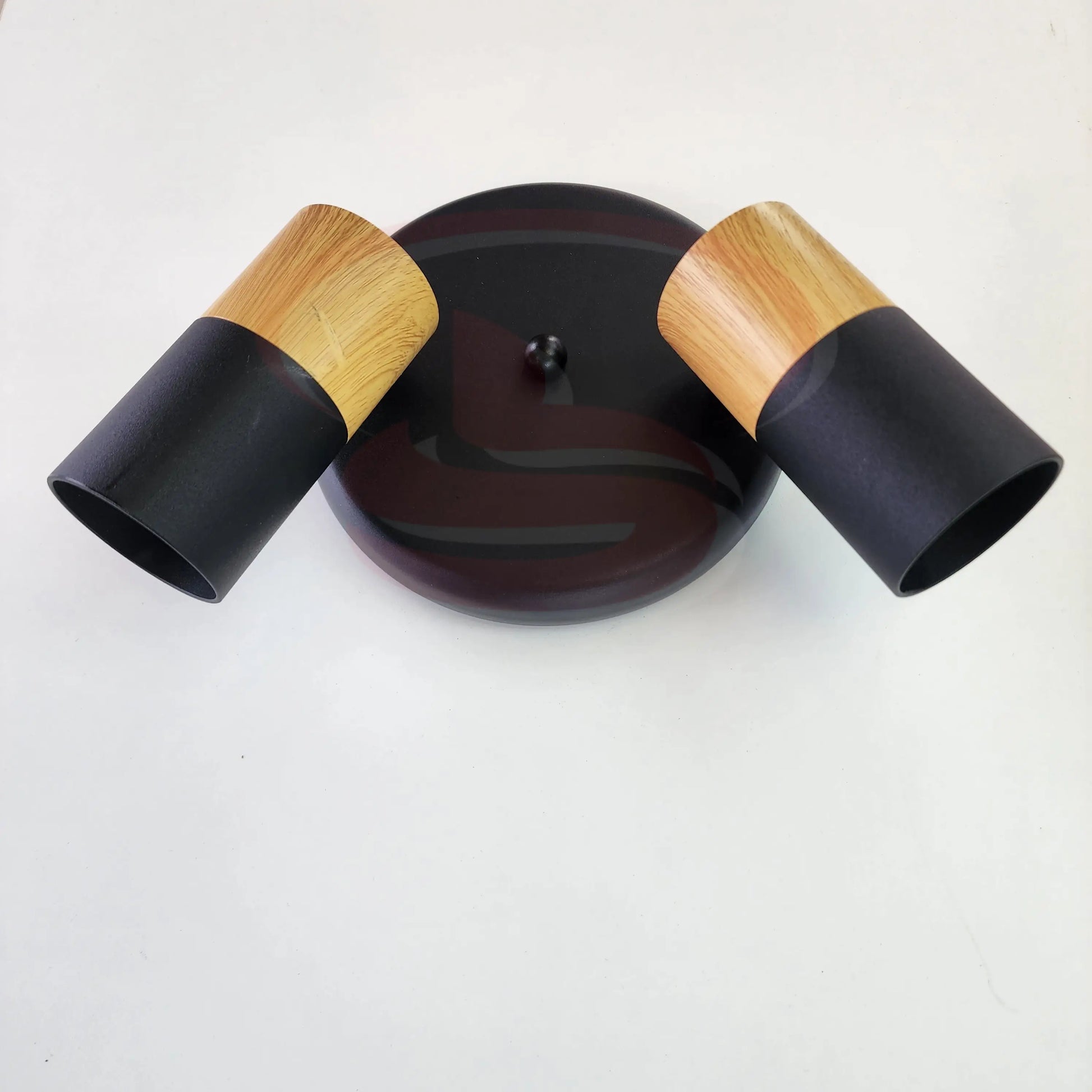 A modern indoor wall spotlight featuring a black round base and wooden cylinder heads, 2 in One GU10 Globe for home and commercial interiors.
Smart Life Lighting & Electrical