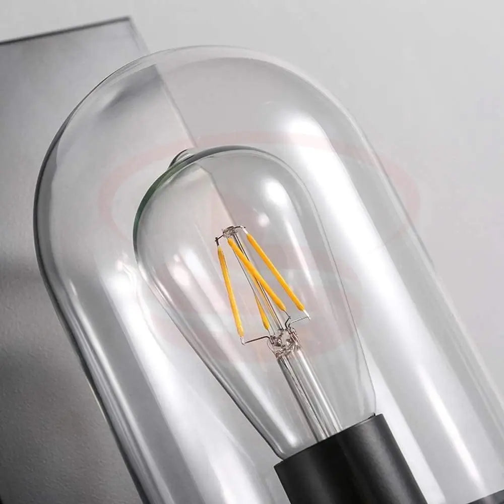 Vintage industrial wall lamp with matte black metal base and clear glass dome featuring an exposed filament bulb.
Smart Life Lighting & Electrical